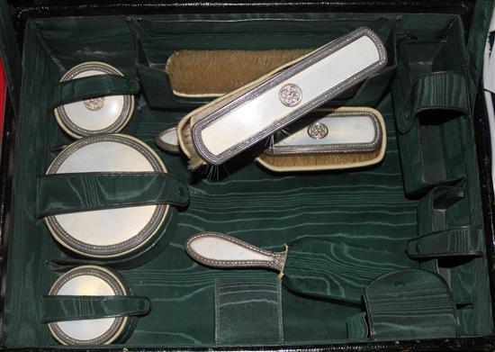 A late 19th/early 20th century Austro-Hungarian travelling toilet case with ten silver and enamel mounted accoutrements